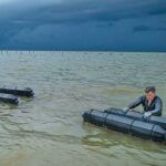 preparing floating cages for the storm